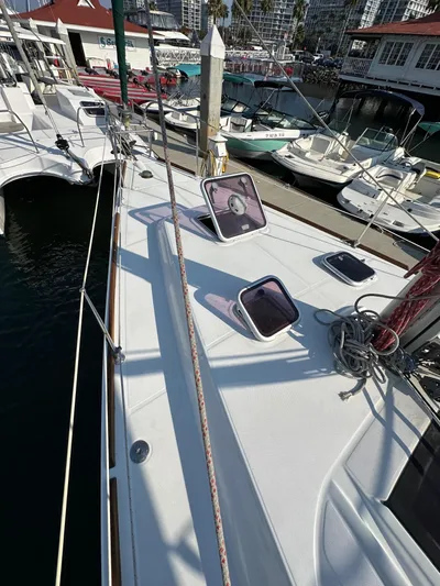 Shamrock Yacht Photos Pics 2011 Beneteau Oceanis 40 sailboat deck with open hatches, docked at marina.