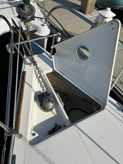 Shamrock Yacht Photos Pics Beneteau Oceanis 40 (2011) anchor locker with open hatch and visible chain.