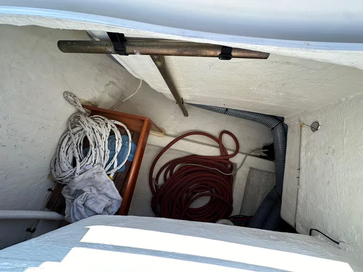 Shamrock Yacht Photos Pics Storage compartment of 2011 Beneteau Oceanis 40 with ropes and equipment.