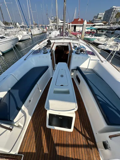 Shamrock Yacht Photos Pics 2011 Beneteau Oceanis 40 sailboat with spacious deck and seating, docked in a marina.