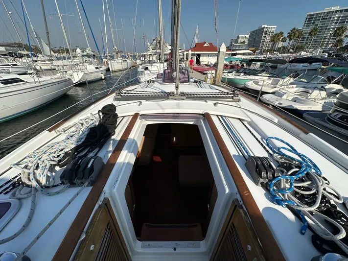 Shamrock Yacht Photos Pics Beneteau Oceanis 40 sailboat, 2011 model, docked in a marina with open cabin view.