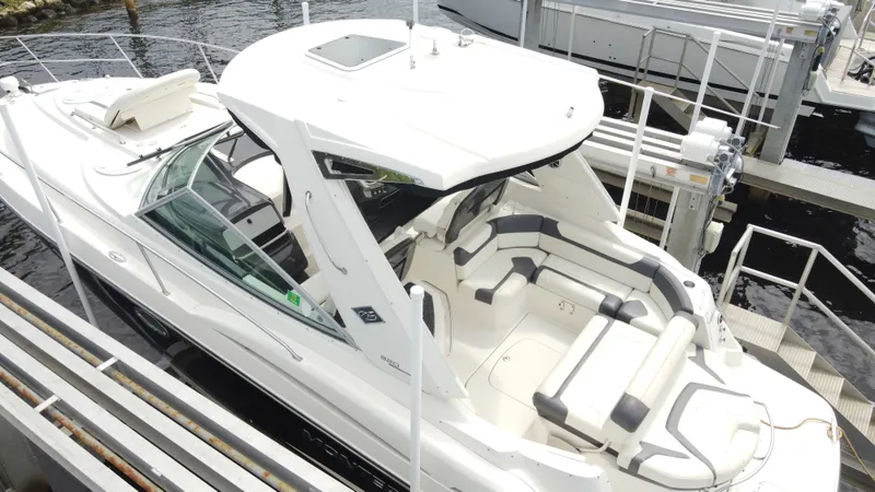 2014 Monterey 320 Sport Yacht Yacht Photos Pics 2014 Monterey 320 Sport Yacht docked, featuring sleek design and spacious seating.