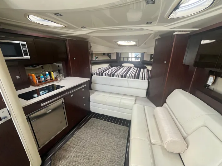 2014 Monterey 320 Sport Yacht Yacht Photos Pics Luxurious interior of 2014 Monterey 320 Sport Yacht with modern kitchen and cozy seating.