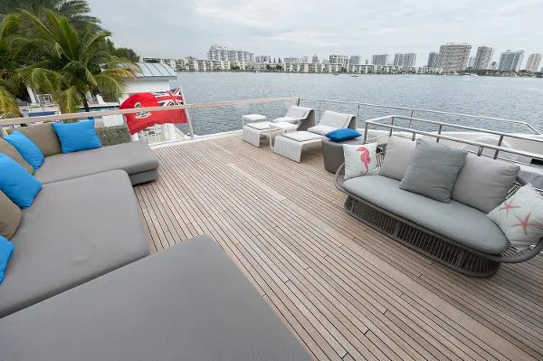 Ryen - Sl106/637 Yacht Photos Pics Spacious deck of 2017 Sanlorenzo SL106 yacht with modern seating and waterfront view.