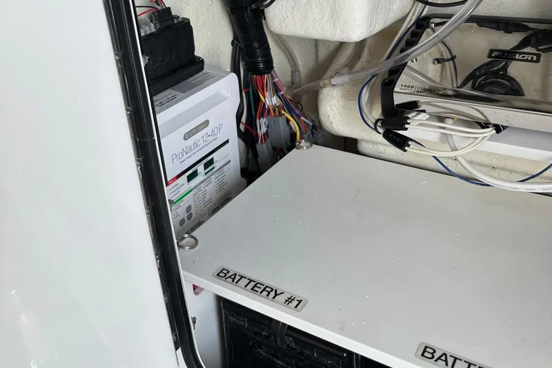 Grey Ghost Yacht Photos Pics 2023 Regulator 34 boat battery compartment with wiring and ProMariner charger.