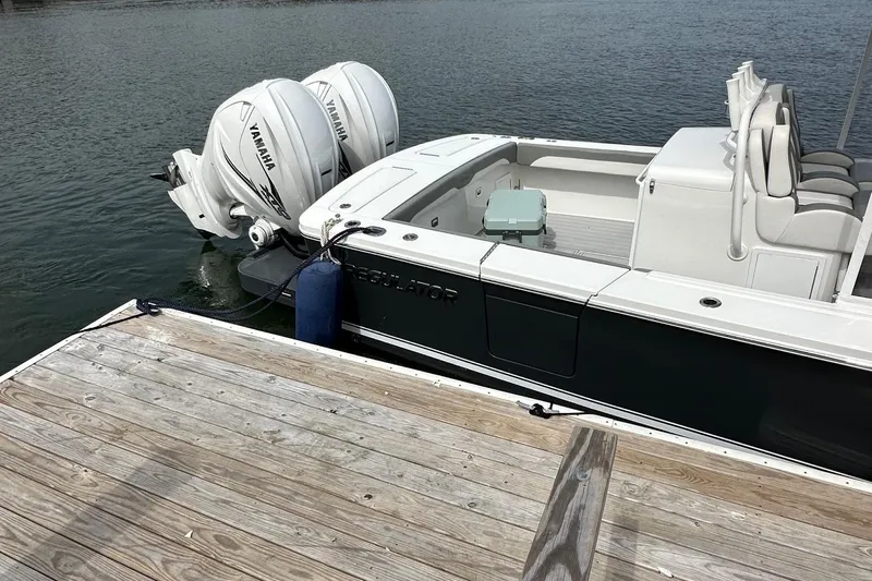 Grey Ghost Yacht Photos Pics 2023 Regulator 34 boat docked with twin Yamaha outboard engines.