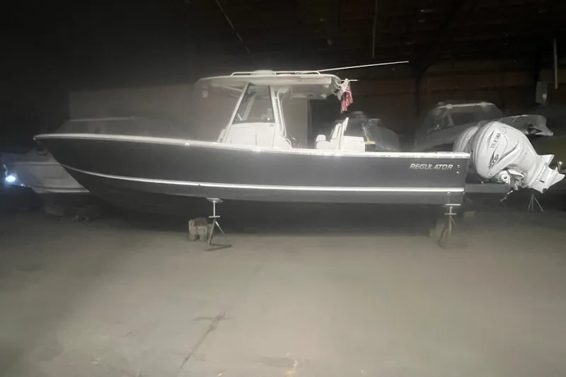 Grey Ghost Yacht Photos Pics 2023 Regulator 34 boat in storage, side view with Yamaha outboard engines.