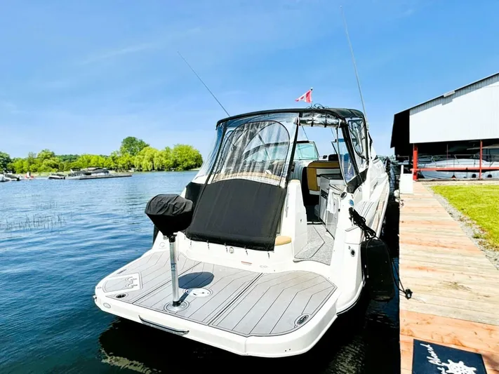  Yacht Photos Pics 2012 Rinker 310 Fiesta Vee boat docked on a sunny day.