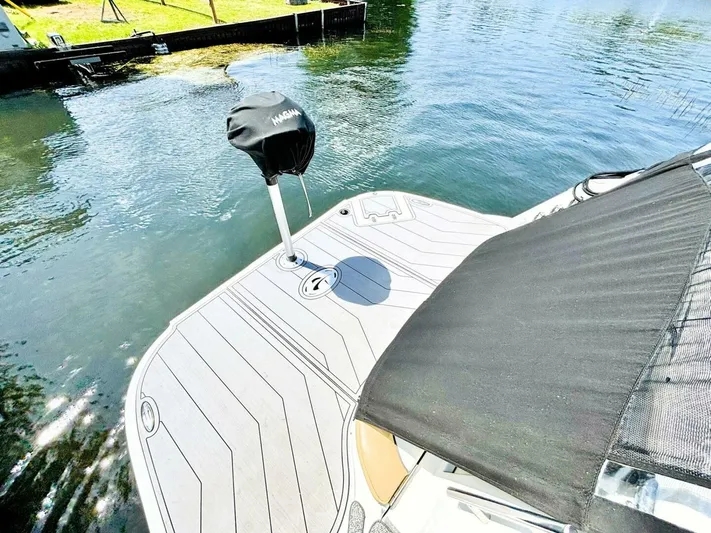  Yacht Photos Pics 2012 Rinker 310 Fiesta Vee boat deck with water view and covered grill.