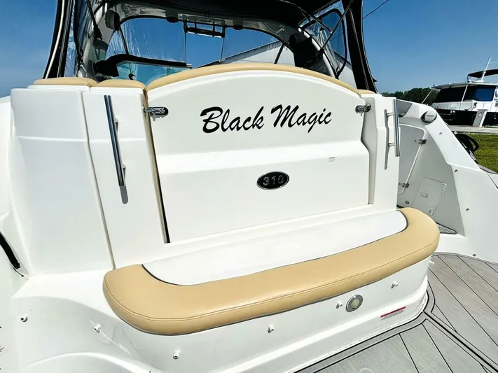  Yacht Photos Pics 2012 Rinker 310 Fiesta Vee boat named "Black Magic" with beige seating.