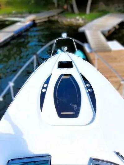  Yacht Photos Pics 2012 Rinker 310 Fiesta Vee boat docked at a marina.