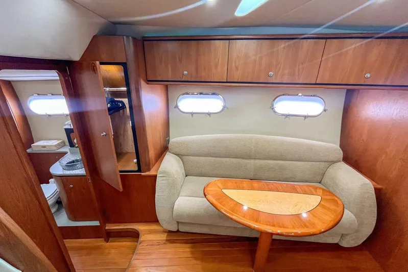  Yacht Photos Pics Luxurious 2007 Tiara 3900 Sovran yacht interior with cozy seating and elegant wood finishes.