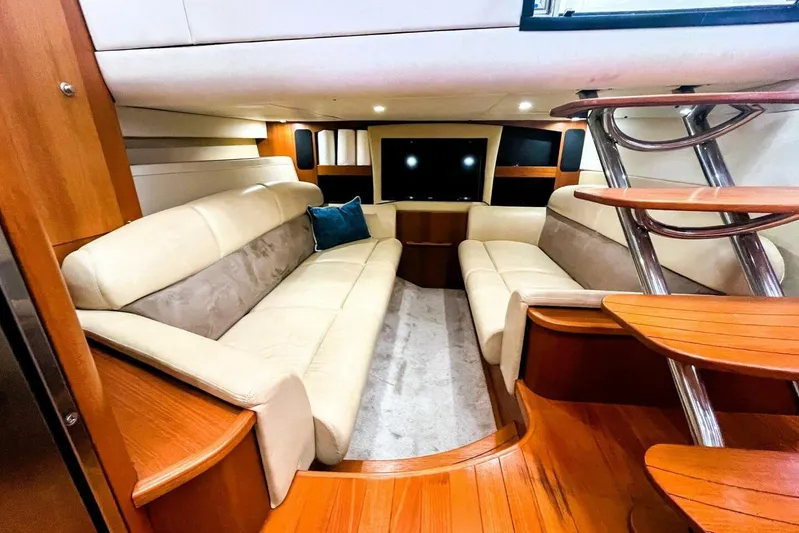  Yacht Photos Pics Luxurious interior of 2007 Tiara 3900 Sovran yacht with plush seating and elegant wood finishes.