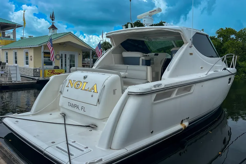  Yacht Photos Pics 2007 Tiara 3900 Sovran yacht docked, featuring sleek design and "NOLA" nameplate, Tampa, FL.