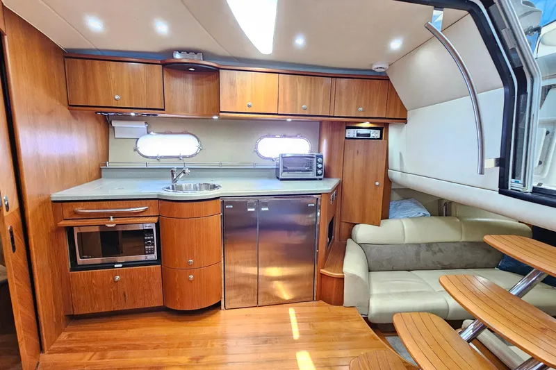  Yacht Photos Pics Luxurious 2007 Tiara Yachts 3900 Sovran interior with modern kitchen and cozy seating area.