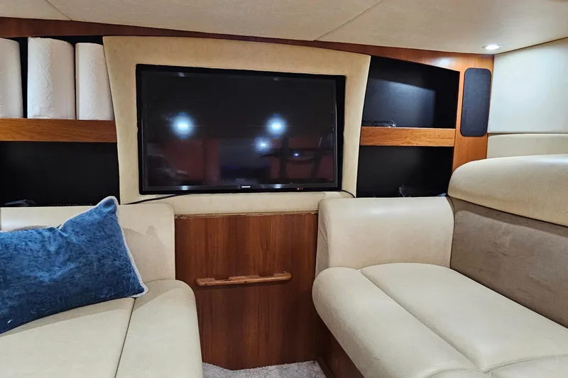  Yacht Photos Pics Luxurious interior of 2007 Tiara Yachts 3900 Sovran with TV and plush seating.