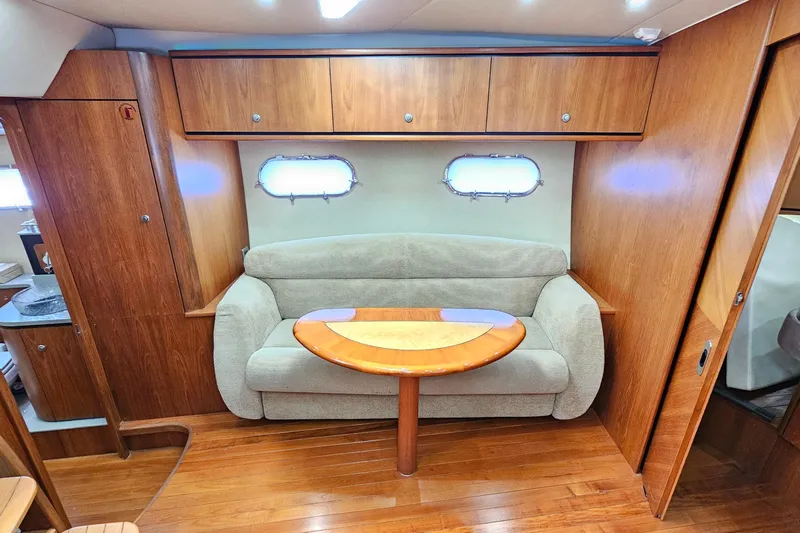  Yacht Photos Pics 2007 Tiara Yachts 3900 Sovran interior with cozy seating and wooden cabinetry.