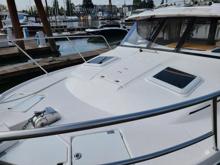  Yacht Photos Pics 2023 Cutwater C-30 Sedan NW Edition docked at a marina, showcasing sleek design and modern features.