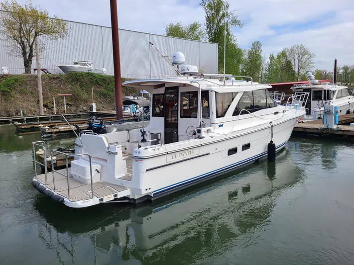 Yacht Photos Pics 2023 Cutwater C-30 Sedan NW Edition boat docked in a marina.