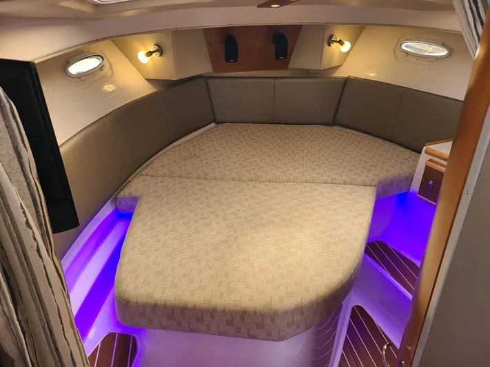  Yacht Photos Pics 2023 Cutwater C-30 Sedan NW Edition cabin with cozy bed and ambient lighting.