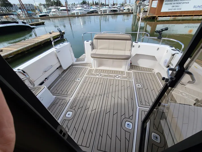  Yacht Photos Pics 2023 Cutwater C-30 Sedan NW Edition boat deck with seating, docked at marina.