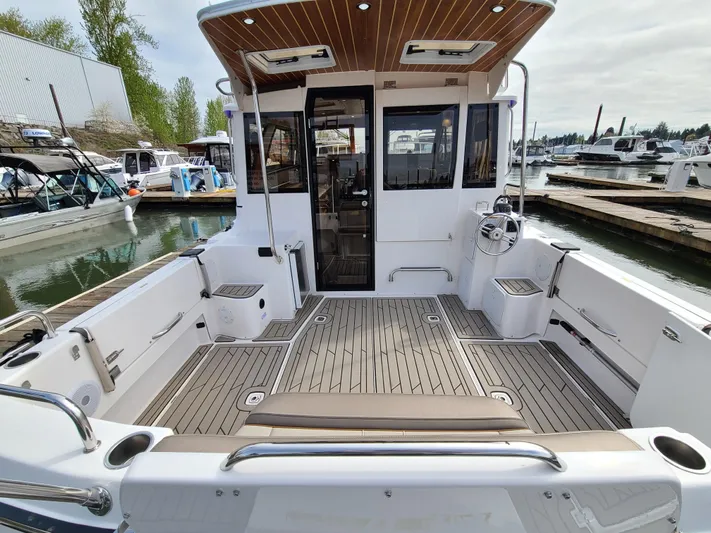  Yacht Photos Pics 2023 Cutwater C-30 Sedan NW Edition boat with spacious deck at marina.