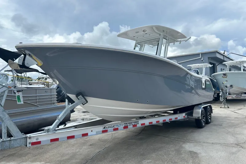  Yacht Photos Pics 2026 Sea Fox 268 Commander boat on trailer, displayed outdoors under cloudy sky.