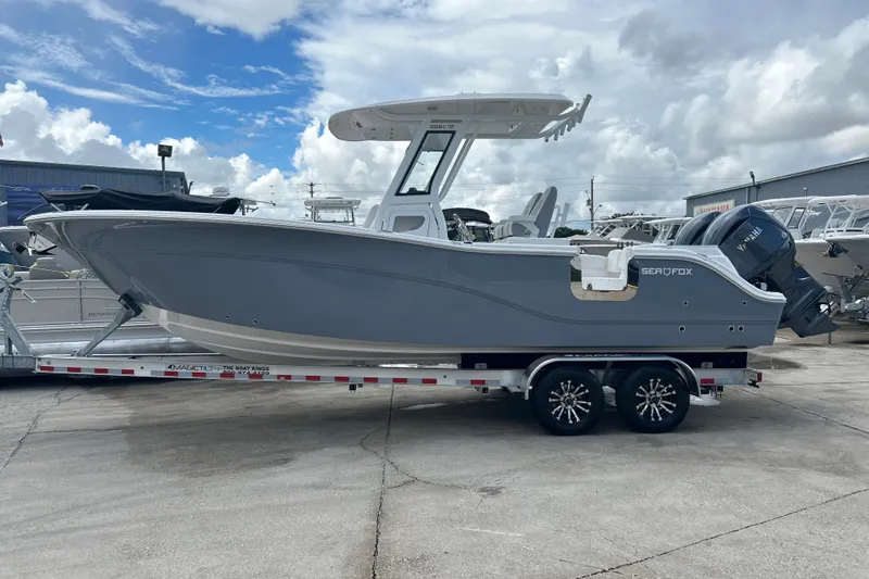  Yacht Photos Pics 2026 Sea Fox 268 Commander boat on trailer under cloudy sky.