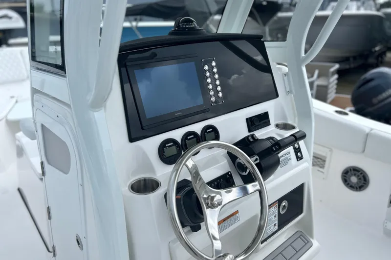  Yacht Photos Pics 2026 Sea Fox 268 Commander boat dashboard with steering wheel and navigation display.