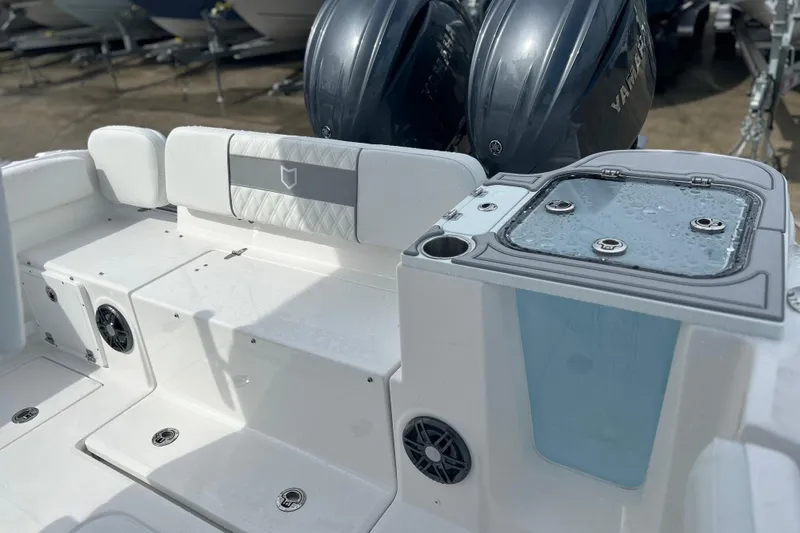  Yacht Photos Pics 2026 Sea Fox 268 Commander boat interior with Yamaha engines, featuring seating and storage.