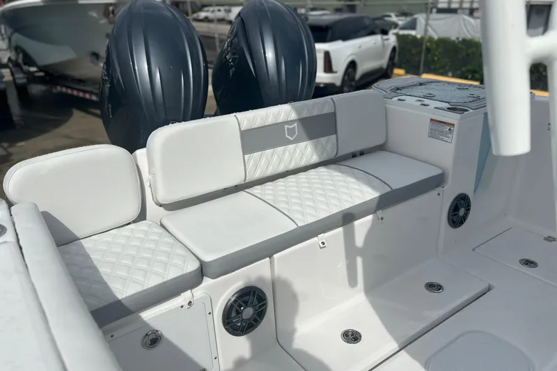  Yacht Photos Pics 2026 Sea Fox 268 Commander boat interior with cushioned seating and dual engines.