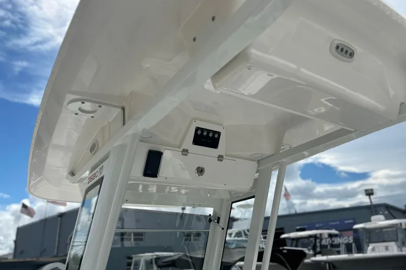  Yacht Photos Pics 2026 Sea Fox 268 Commander boat console under a clear blue sky.