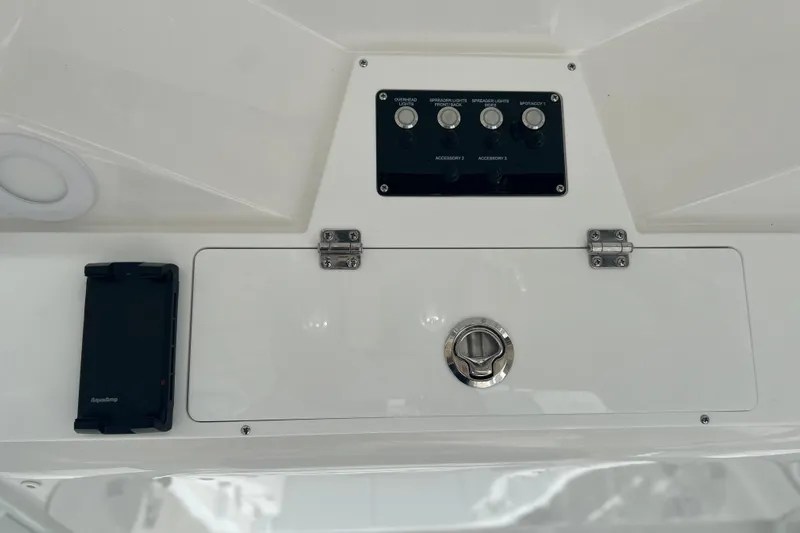  Yacht Photos Pics Control panel of 2026 Sea Fox 268 Commander boat with switches and storage compartment.