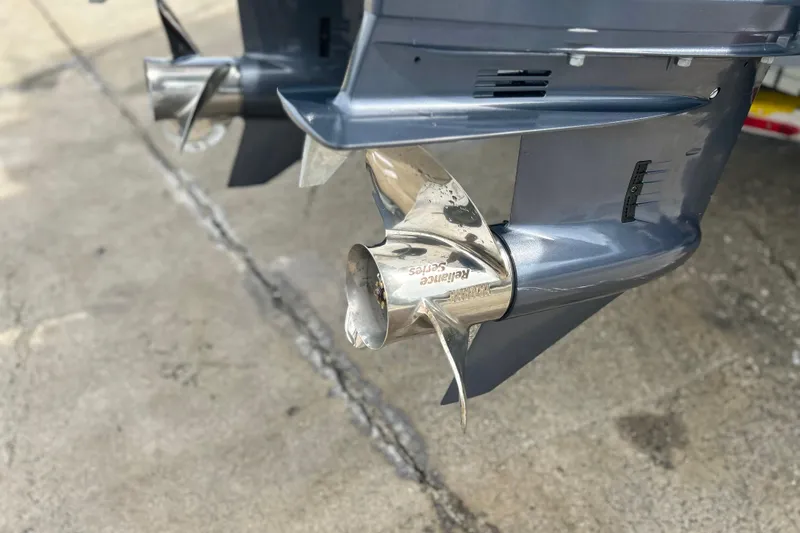  Yacht Photos Pics Propellers of a 2026 Sea Fox 268 Commander boat on a concrete surface.