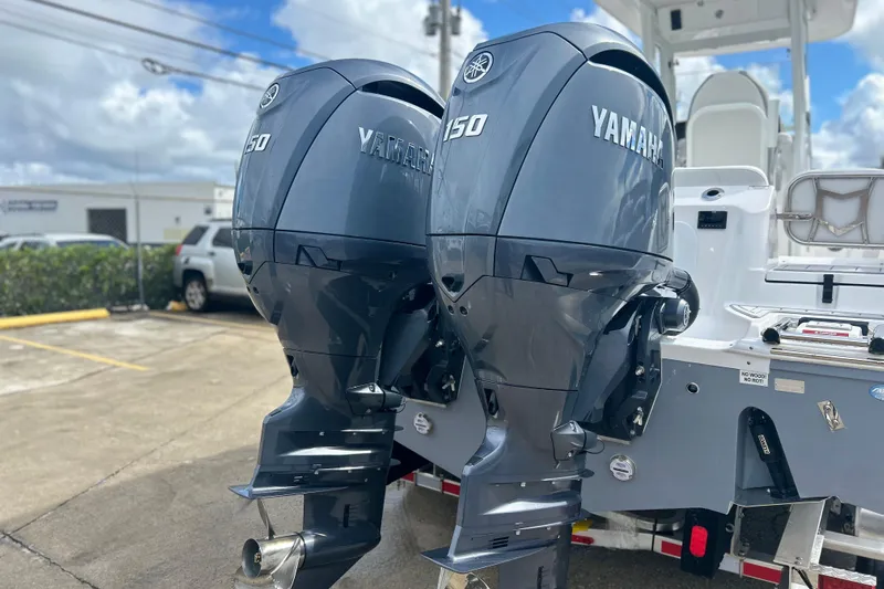  Yacht Photos Pics 2026 Sea Fox 268 Commander with dual Yamaha 150 engines, parked outdoors.