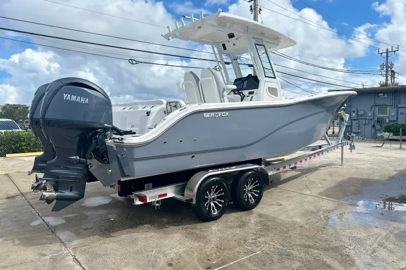  Yacht Photos Pics 2026 Sea Fox 268 Commander boat on trailer with Yamaha engine, parked outdoors.