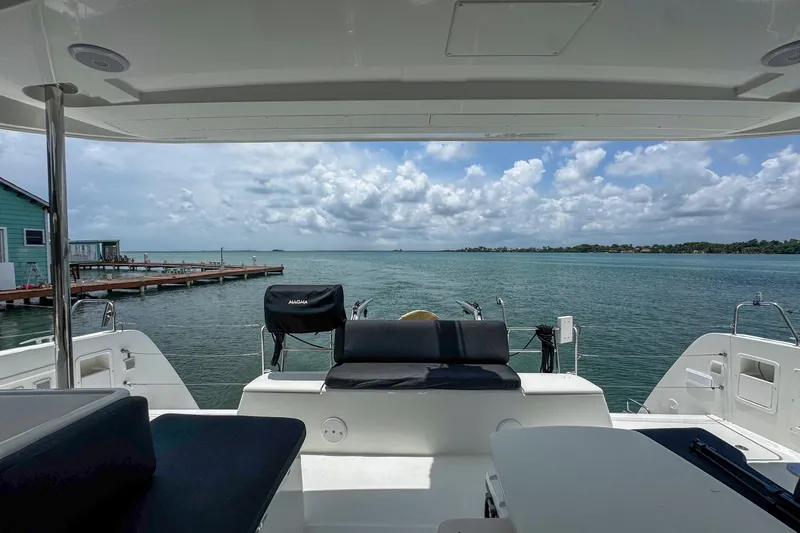 Wanderlust Yacht Photos Pics 2020 Lagoon 40 catamaran with scenic ocean view and cloudy sky.