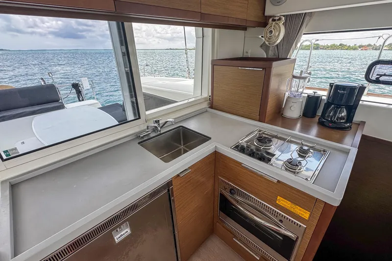 Wanderlust Yacht Photos Pics Modern kitchen interior on 2020 Lagoon 40 catamaran with ocean view.