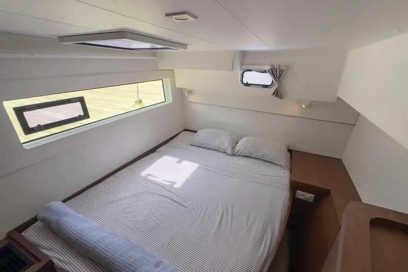 Wanderlust Yacht Photos Pics Interior cabin of 2020 Lagoon 40 catamaran with bed and windows.