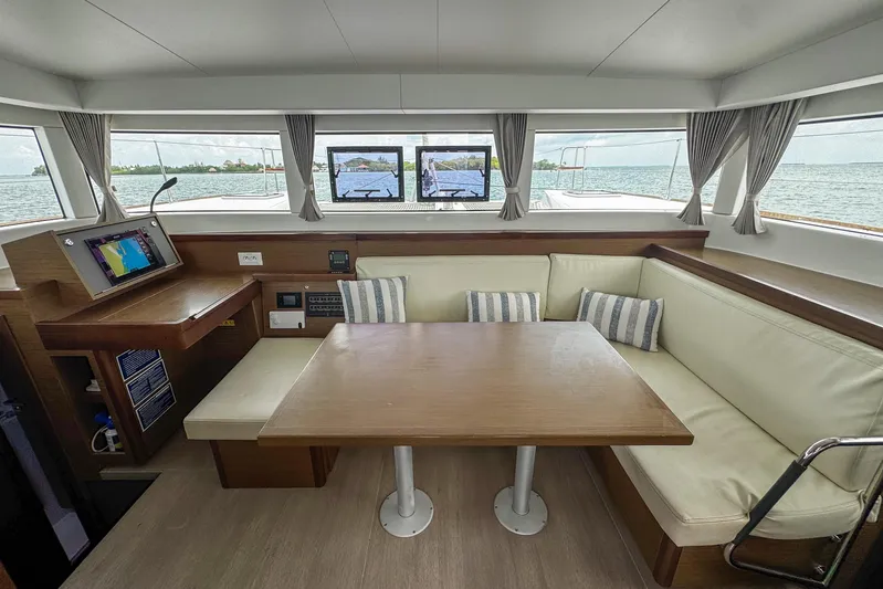 Wanderlust Yacht Photos Pics Interior of 2020 Lagoon 40 catamaran with navigation station and cozy seating area.
