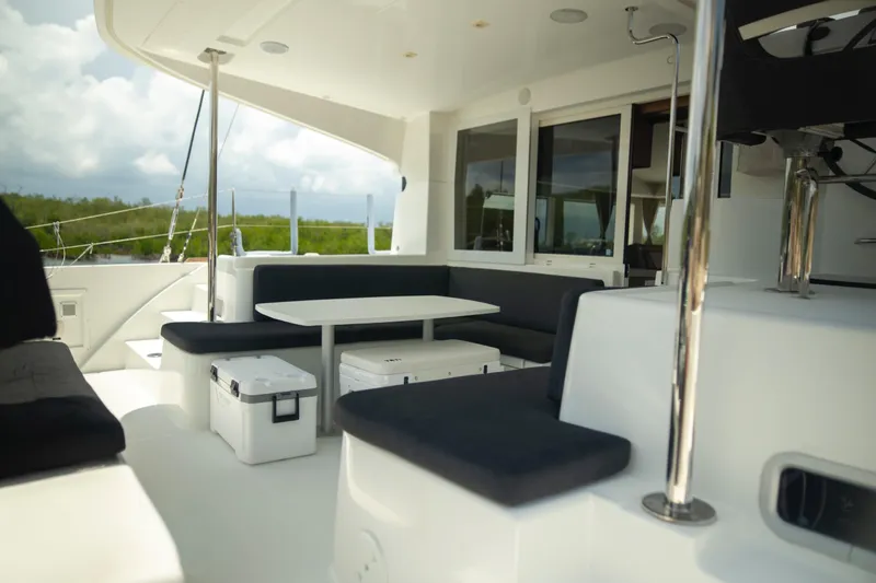 Wanderlust Yacht Photos Pics Spacious deck of 2020 Lagoon 40 catamaran with seating and table.