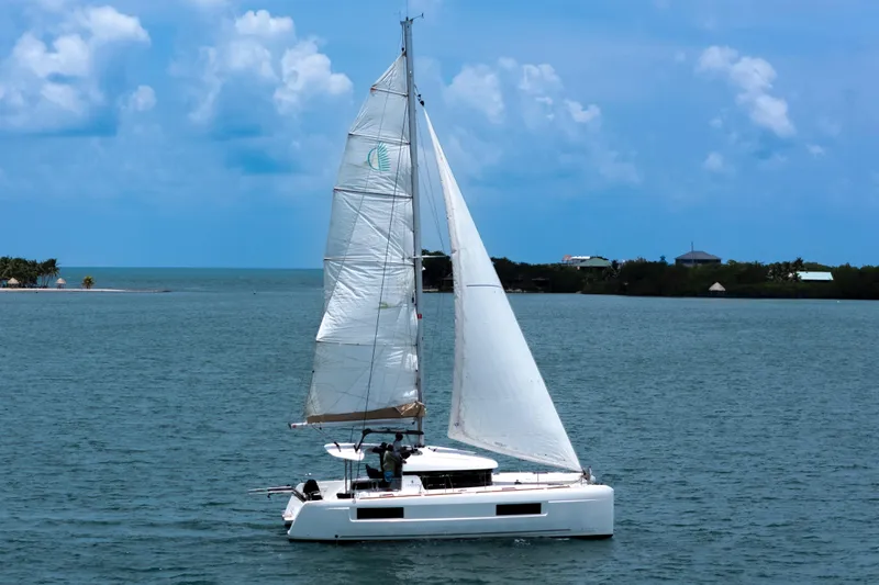 Wanderlust Yacht Photos Pics Sailing catamaran Lagoon 40, 2020 model, cruising on a serene blue sea.