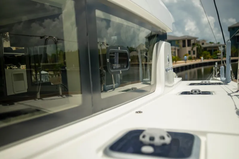 Wanderlust Yacht Photos Pics 2020 Lagoon 40 catamaran docked, showcasing sleek design and modern features.