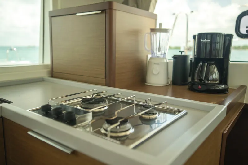 Wanderlust Yacht Photos Pics Modern kitchen in 2020 Lagoon 40 yacht with stove, blender, and coffee maker.