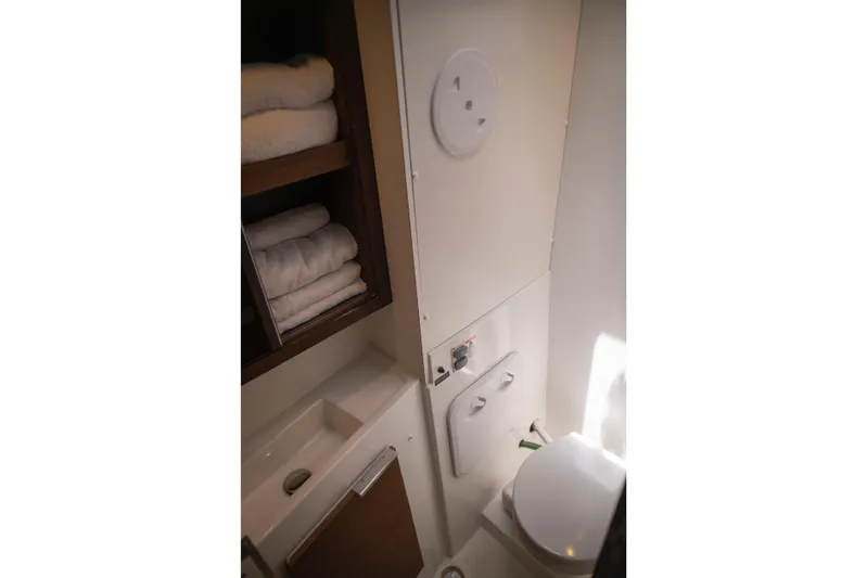 Wanderlust Yacht Photos Pics Compact bathroom in 2020 Lagoon 40 yacht with toilet and towel storage.