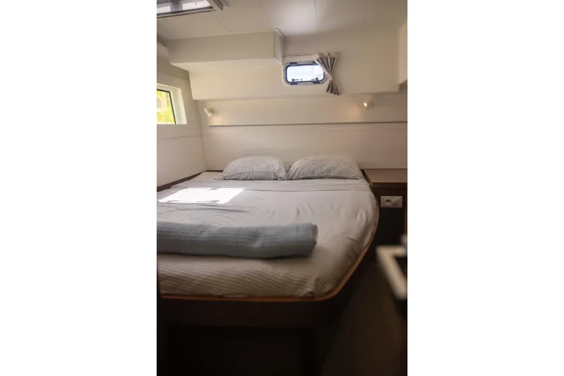 Wanderlust Yacht Photos Pics Cozy bedroom interior of 2020 Lagoon 40 catamaran with natural light and modern design.