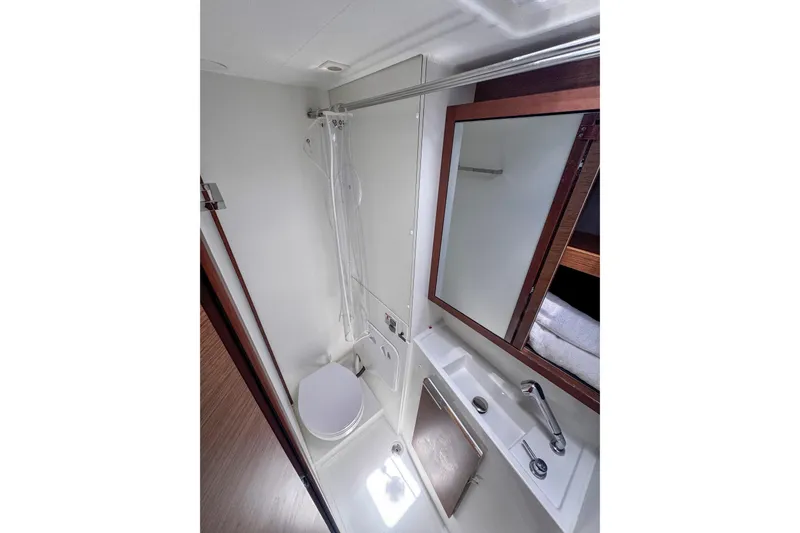 Wanderlust Yacht Photos Pics Modern bathroom in 2020 Lagoon 40 yacht with shower, toilet, and sink.