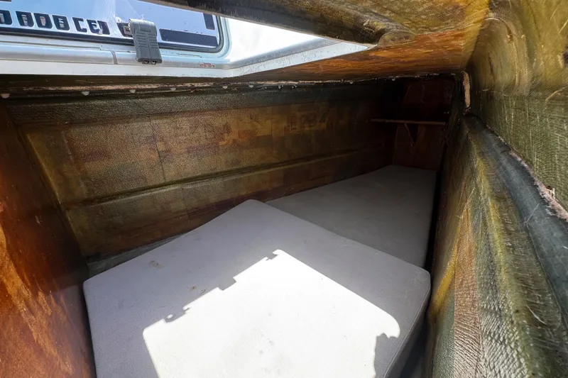 Wanderlust Yacht Photos Pics Interior cabin space of a 2020 Lagoon 40 catamaran, featuring a compact sleeping area.