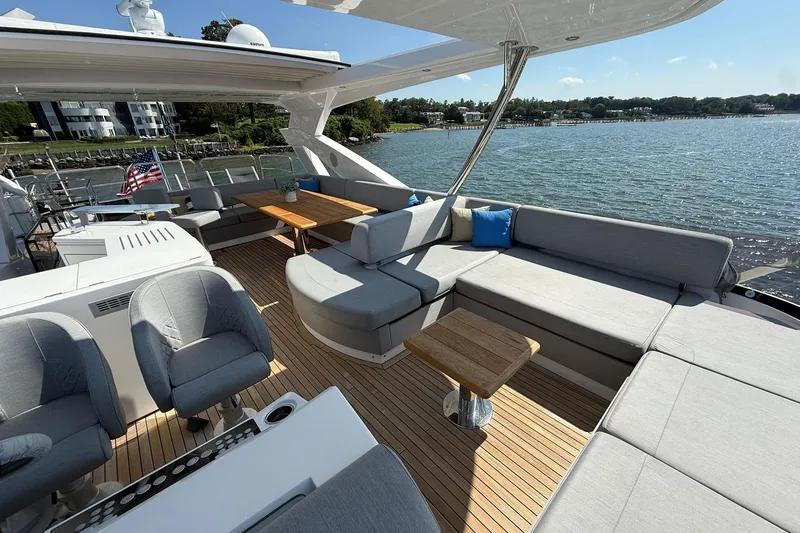  Yacht Photos Pics Luxurious Sunseeker 76 Yacht 2021 with spacious deck, elegant seating, and scenic waterfront view.