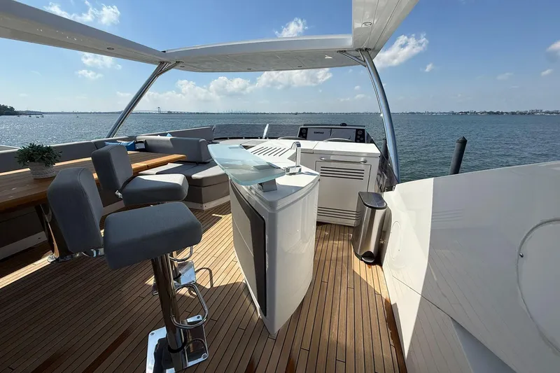  Yacht Photos Pics Luxurious 2021 Sunseeker 76 Yacht deck with modern seating and ocean view.
